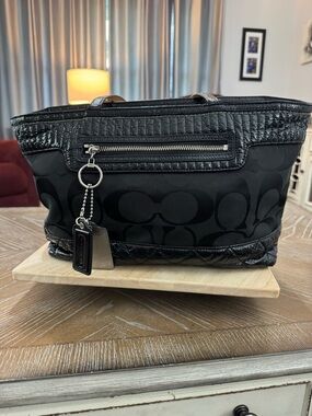 Coach Poppy Signature Quilted Tote in black.